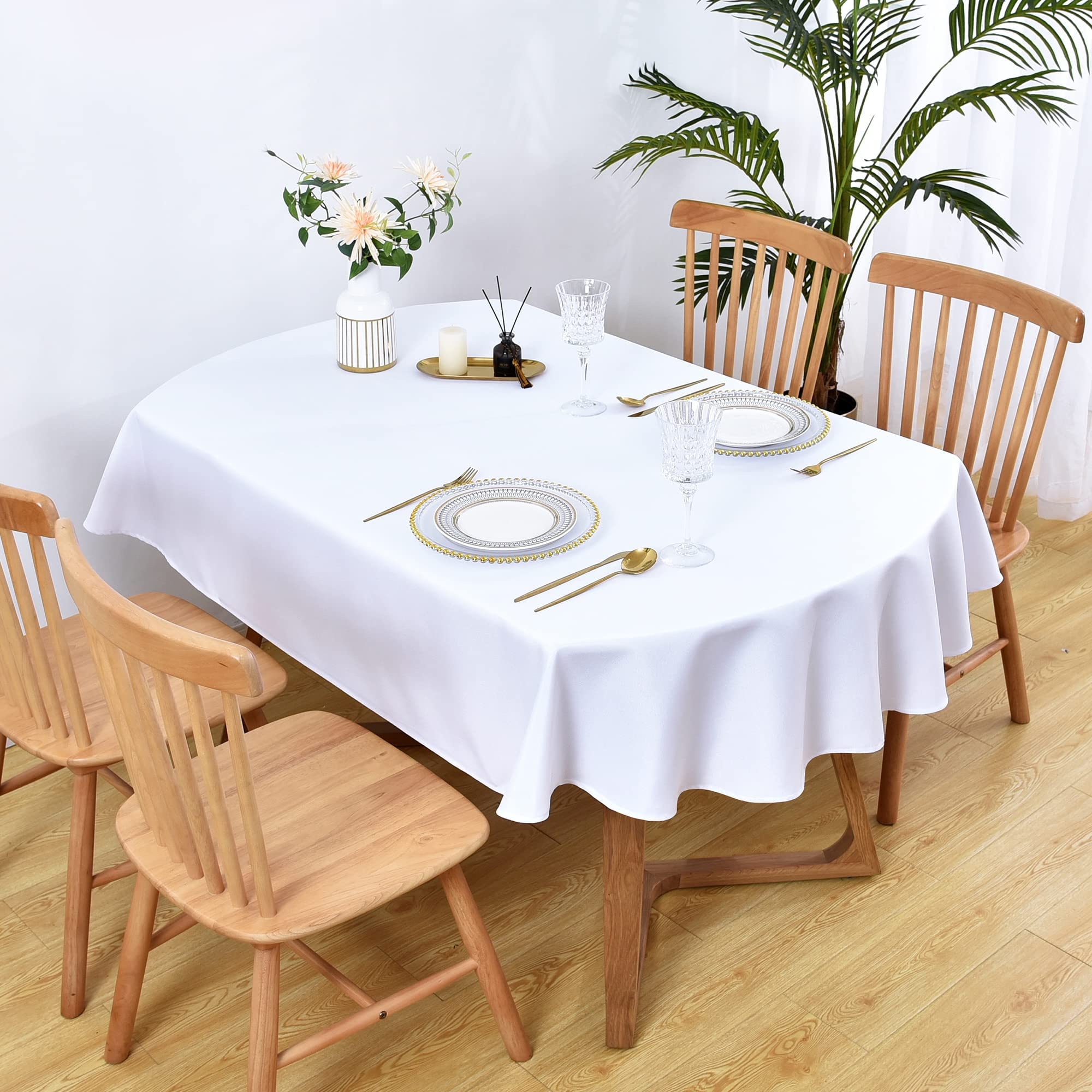 Wolkemer oval tablecloth with hemmed edges on elegant table