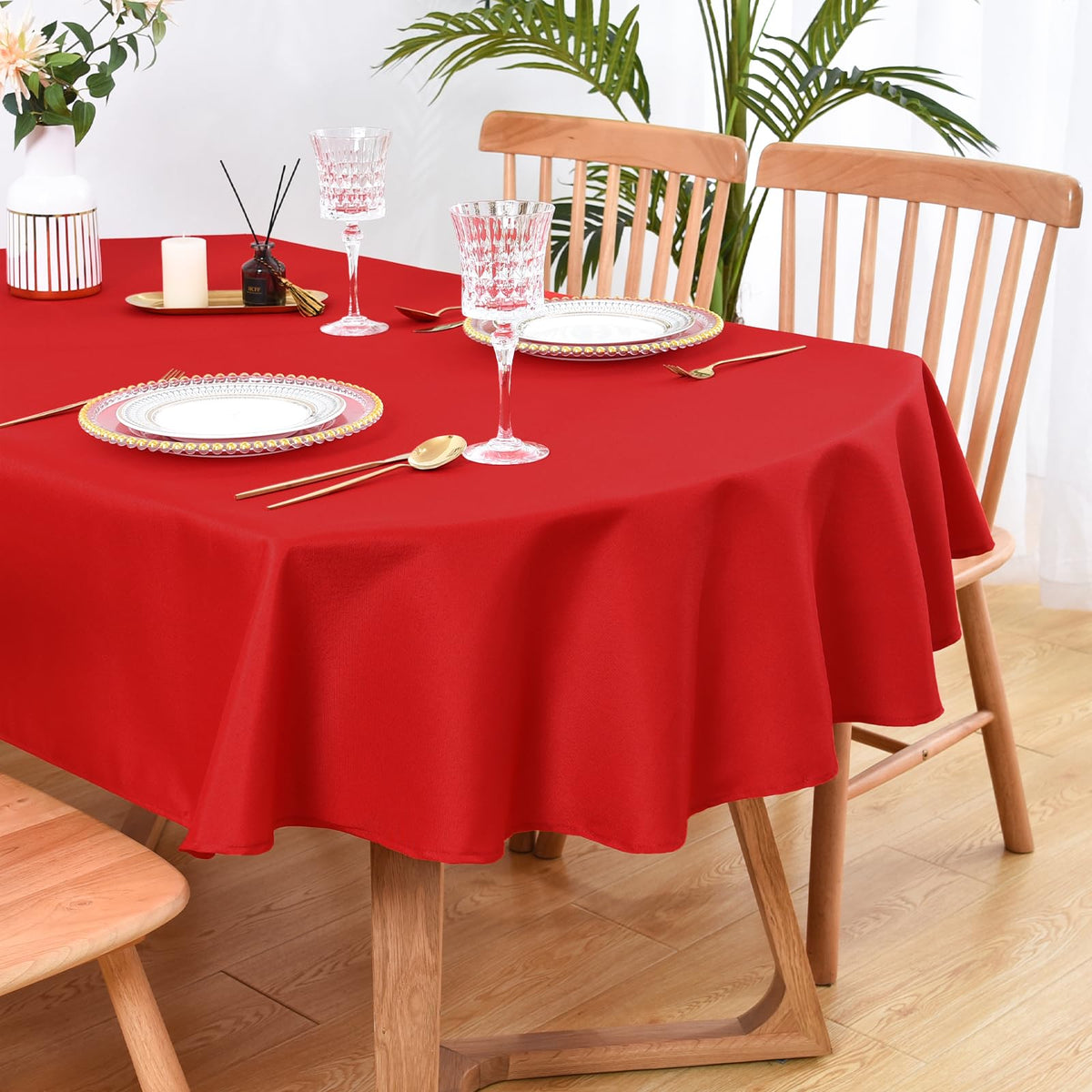 Wolkemer solid red oval tablecloth 52x70 inches protects surfaces while adding color