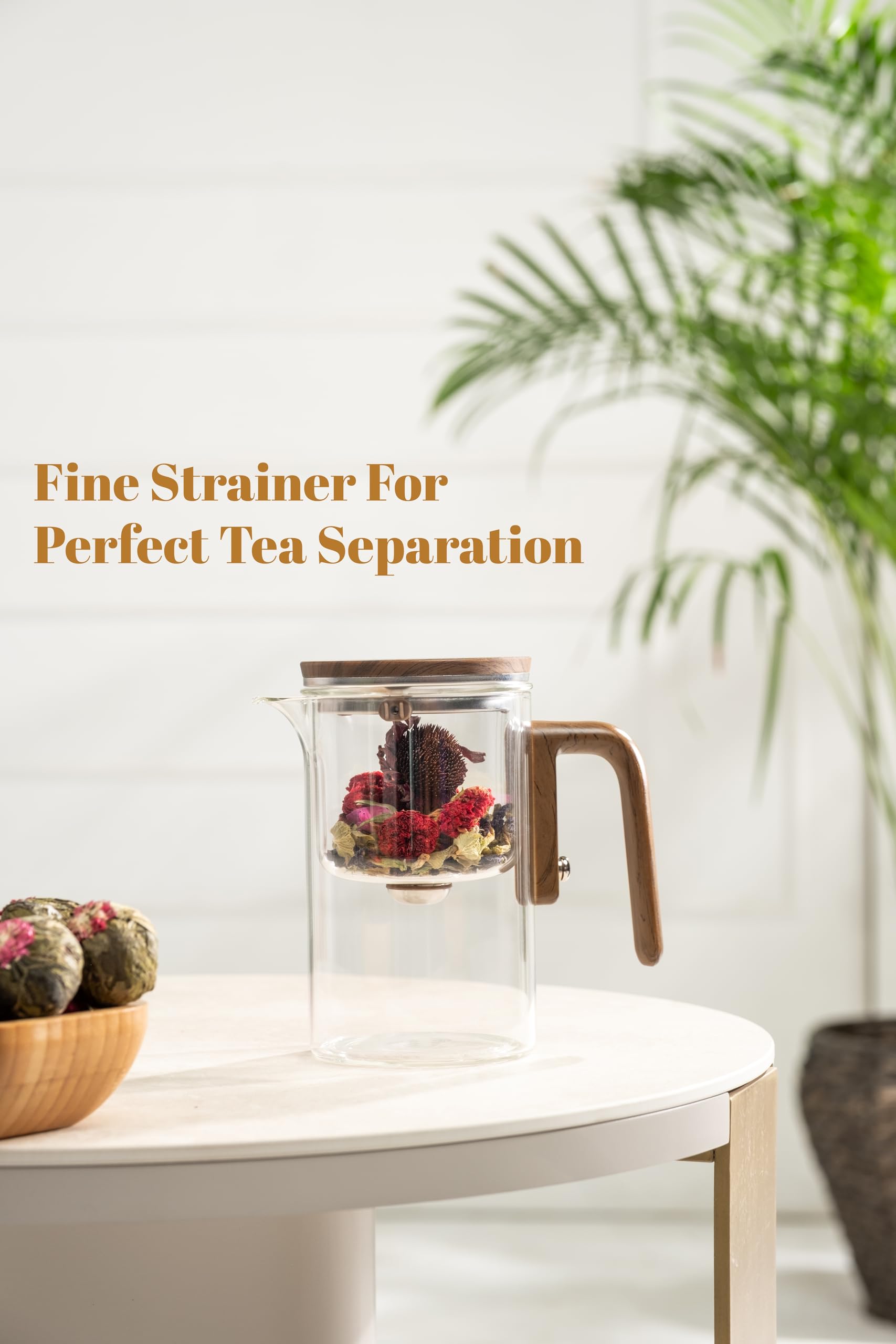 WOLTBLOOM Enchanti Tea Pot showcases blooming leaves through crystal-clear glass.