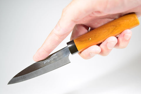 Natural wooden sheath protects blade during transport and storage.