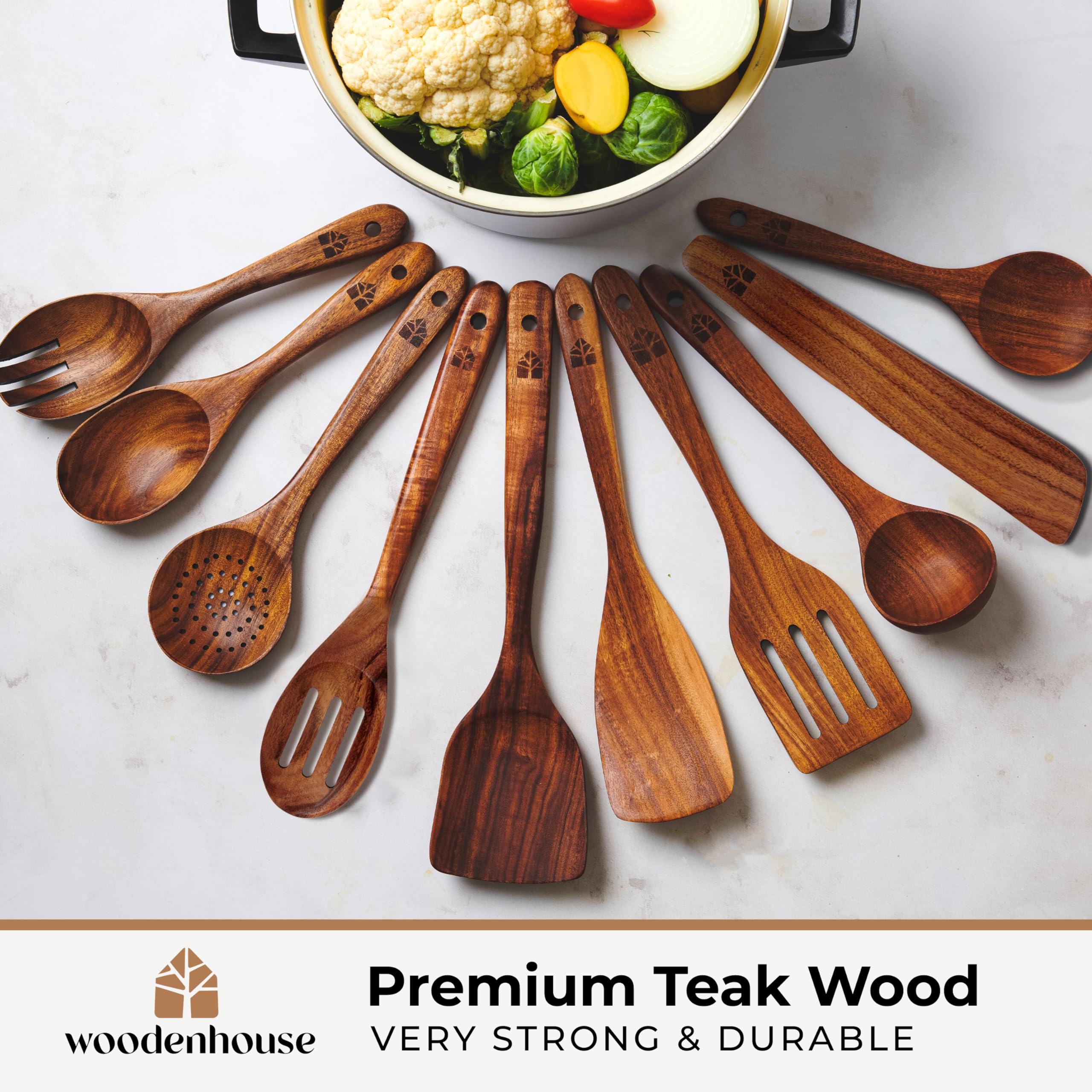 Woodenhouse teak barrel with drainage demonstrates organized utensil storage.