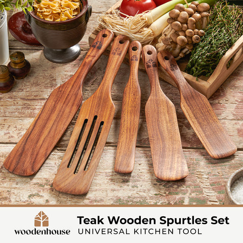 Close-up side angle of Woodenhouse teak spurtles highlighting angled edges for jar access.