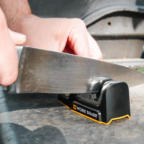 Work Sharp ceramic honing wheel refining knife edges for daily maintenance.