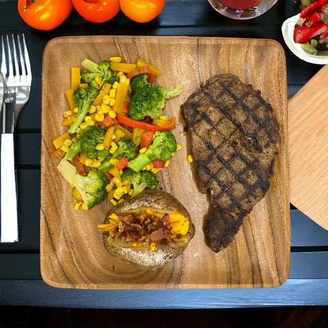 WRIGHTMART wooden plates 4-pack on table for a cozy dinner party.