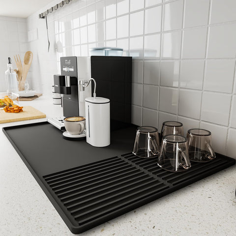 WUDIALIEN silicone coffee mat with raised edges catching spills under the coffee maker