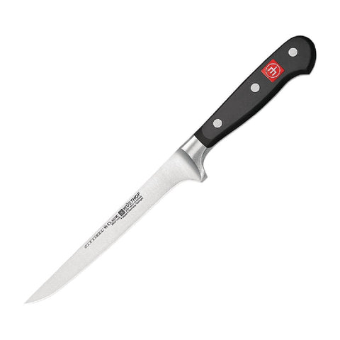 Using the knife to trim meat for clean, accurate cuts