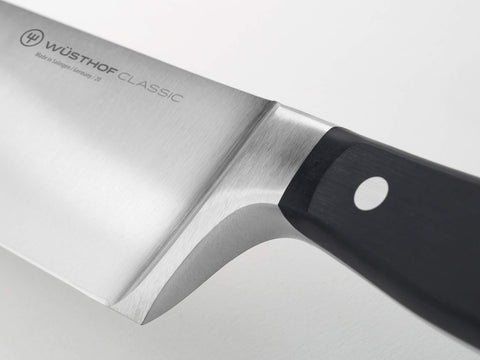 Knife on cutting board ready for chopping vegetables with balance