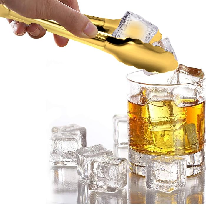 Close-up of XEVOM gold-plated tongs showing durable finish