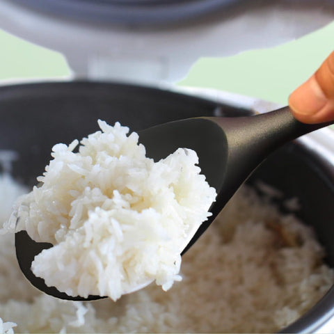 XiaoZu serving spoon in action highlights multi-use for cooking and serving.