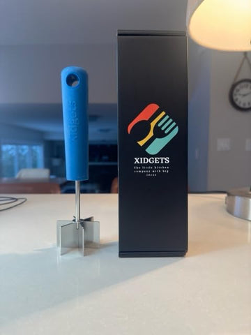 Xidgets Lagoon Blue handle detail adds color to the kitchen.