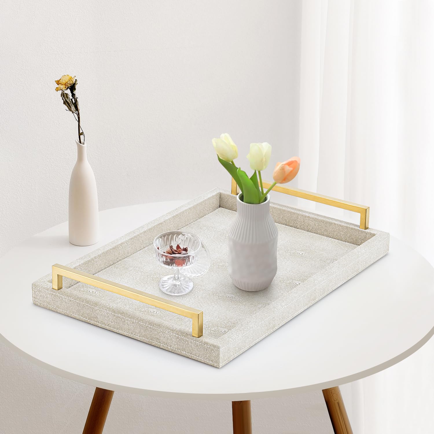XIGEXIGE ivory shagreen tray on a coffee table with display items.