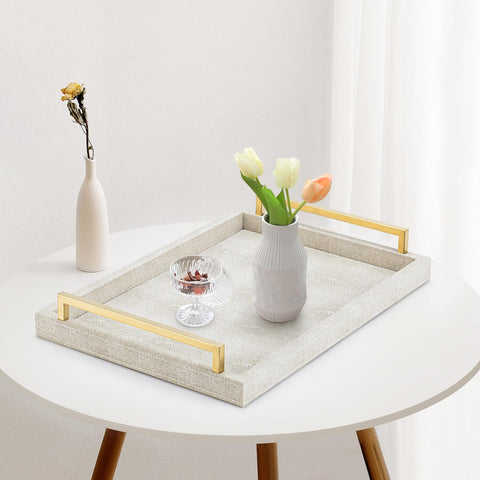 XIGEXIGE ivory shagreen tray on a coffee table with display items.