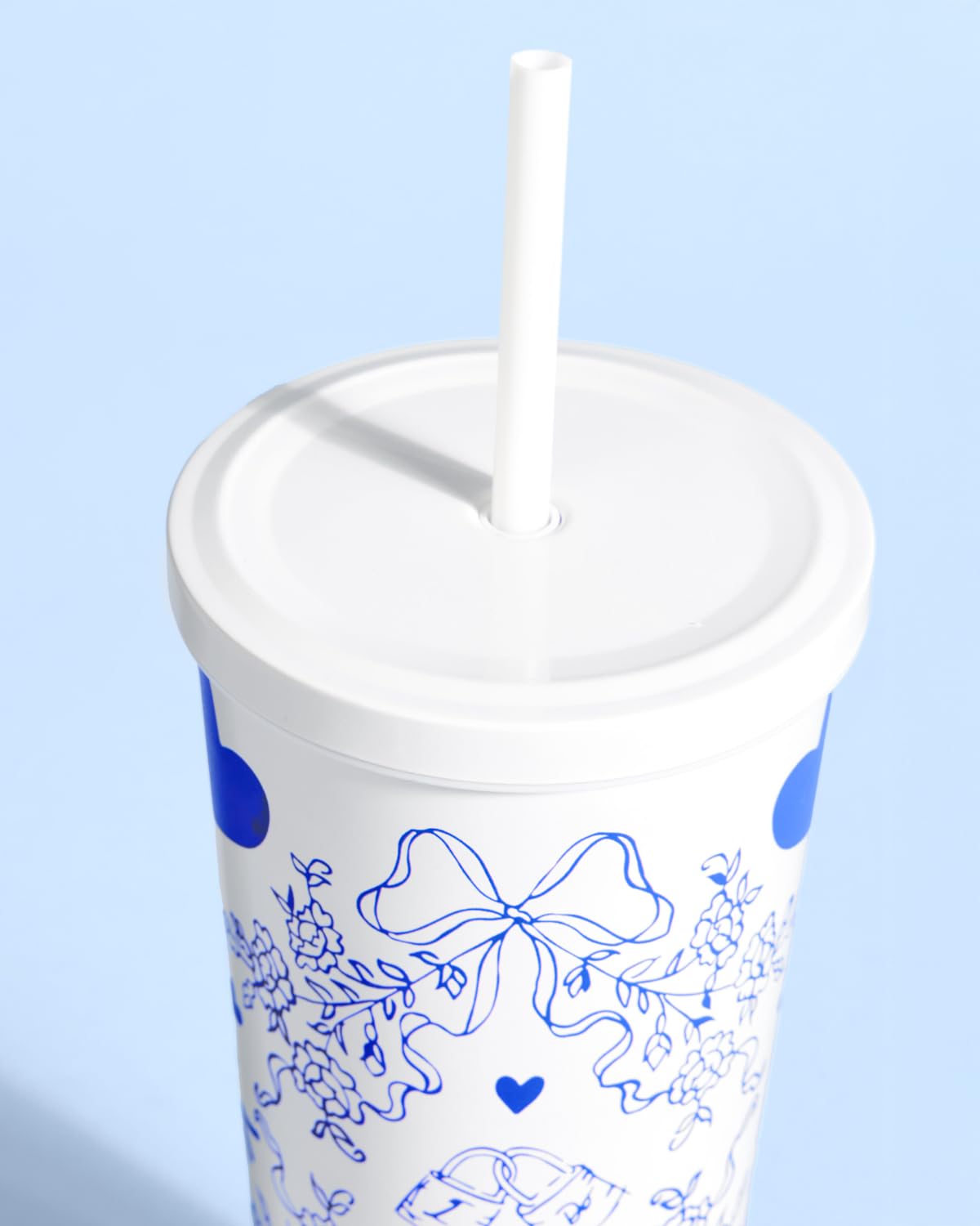 xo Fetti white tumbler close-up showing glossy finish and design details