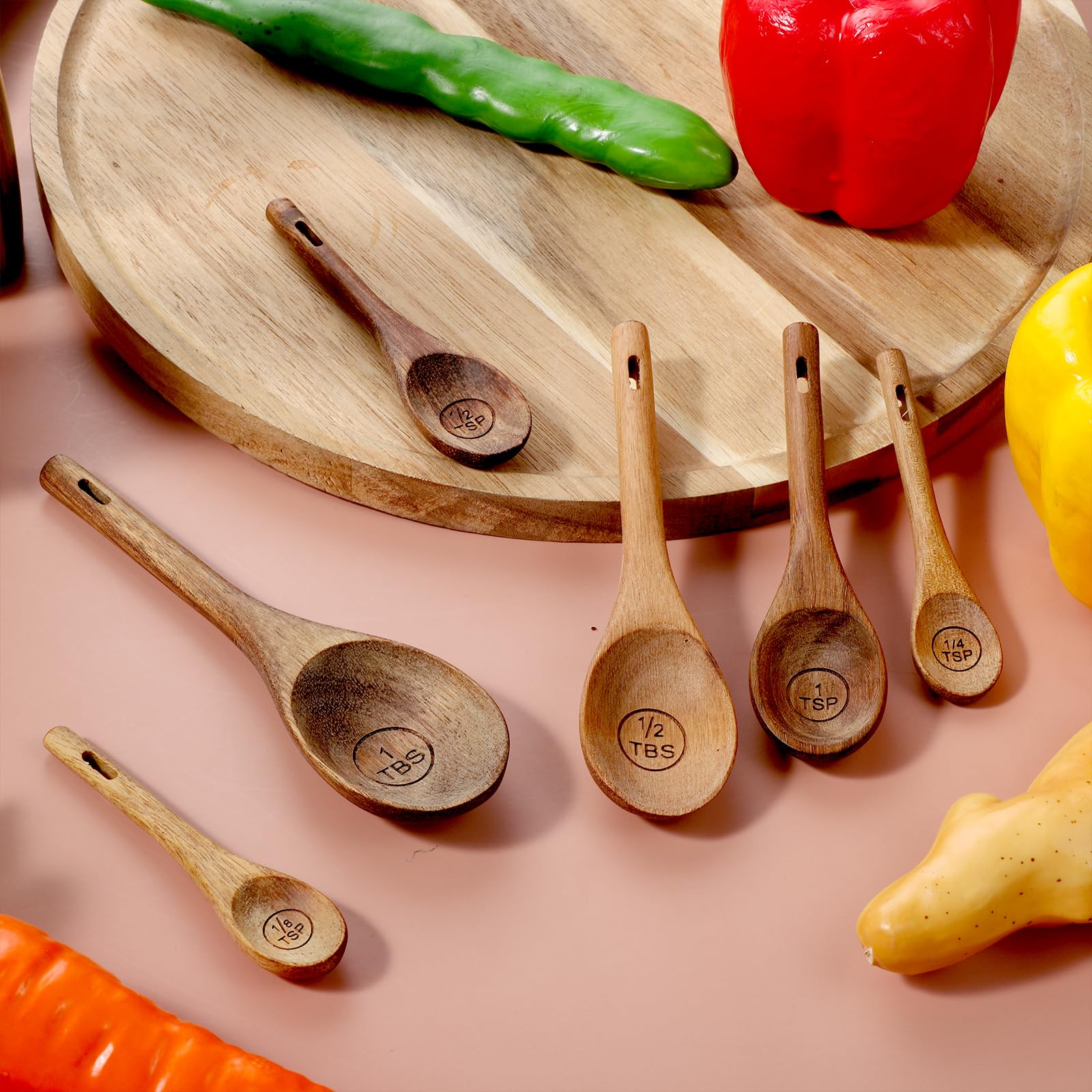 Xyembu spoon set includes a leather tie for tidy hanging storage.