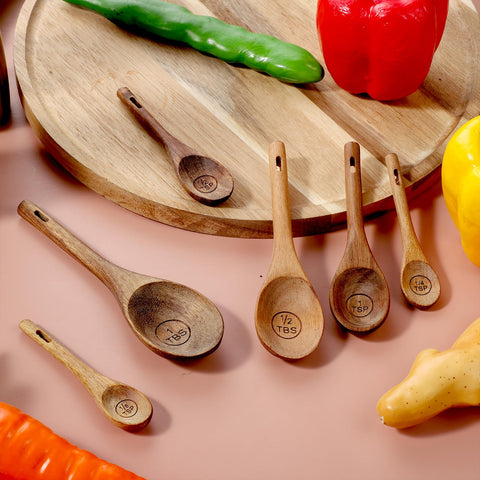 Xyembu spoon set includes a leather tie for tidy hanging storage.