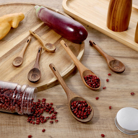 Xyembu wooden spoons with smooth grain and rounded edges for easy use.