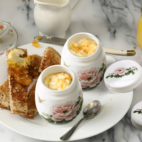 Xylarnoveth porcelain egg cooker 220ml ensures even heat for creamy texture.