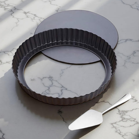 Yamteck 9-inch tart pan with removable bottom for easy demolding and clean edges.