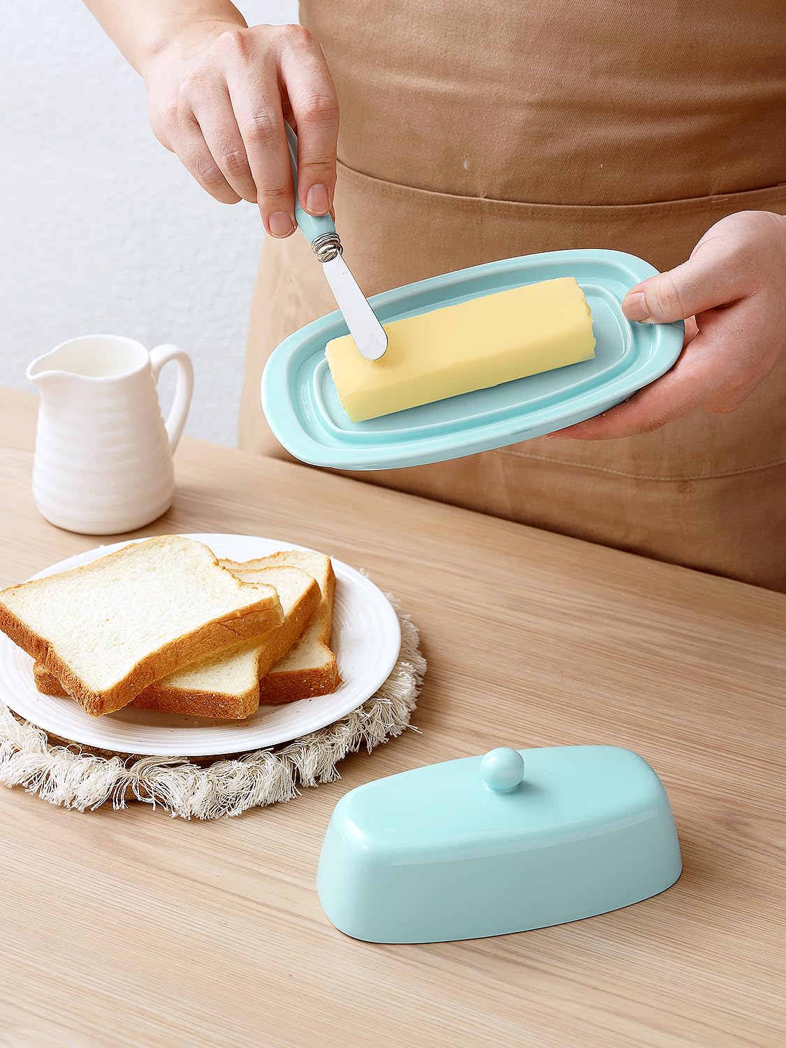 Turquoise cover knob handle makes opening the butter dish easy