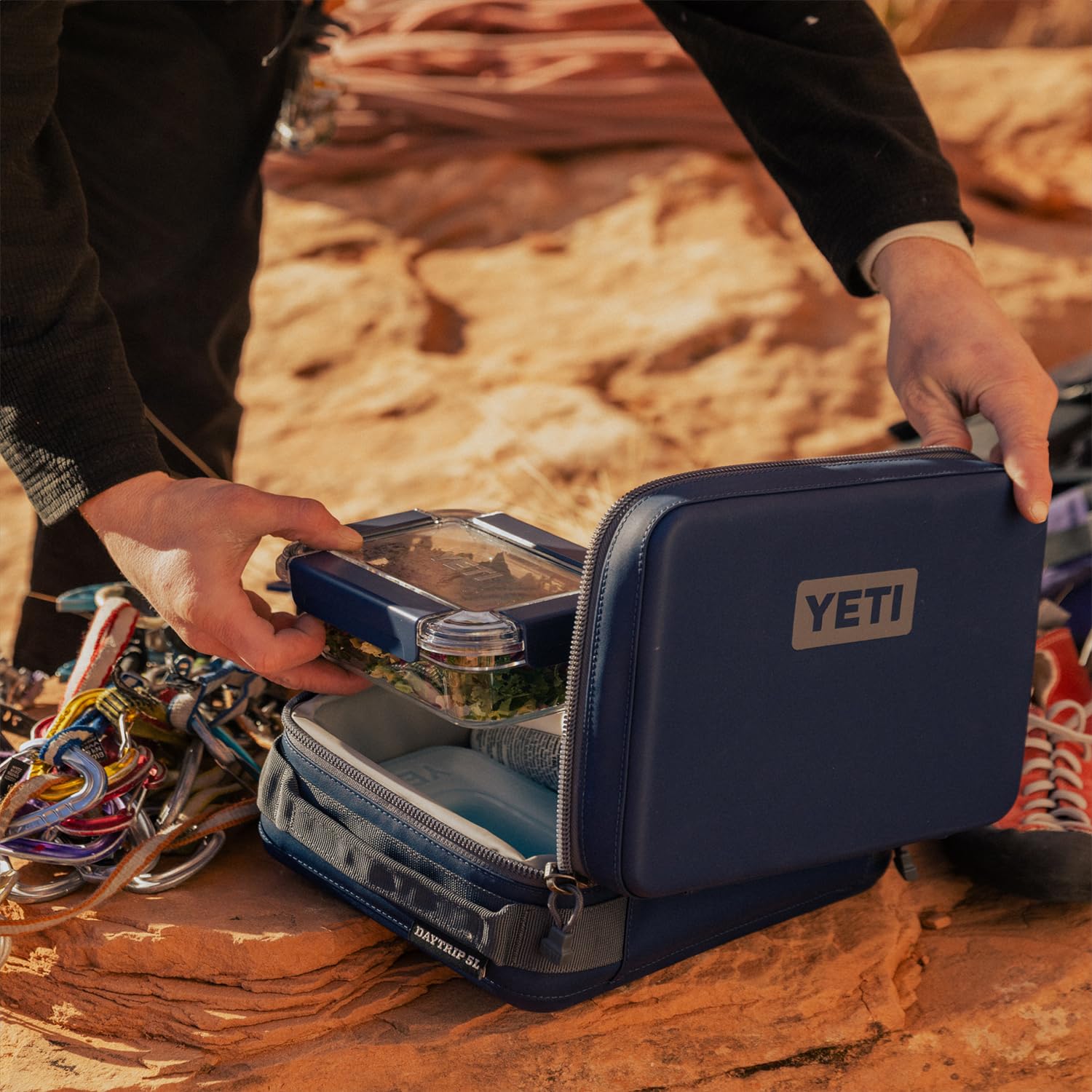 YETI Daytrip 5L carrying handle enables hands-free transport.
