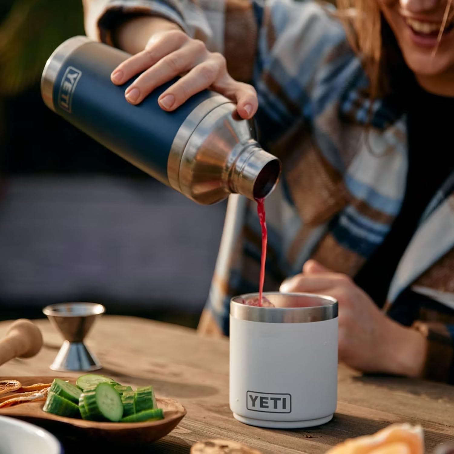 YETI Rambler 20 oz Cocktail Shaker demonstrates easy press lid for quick serving.