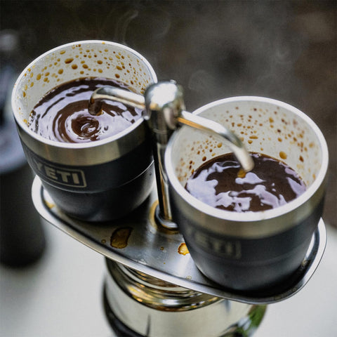 YETI Rambler stackable cup shown in a camp kitchen.