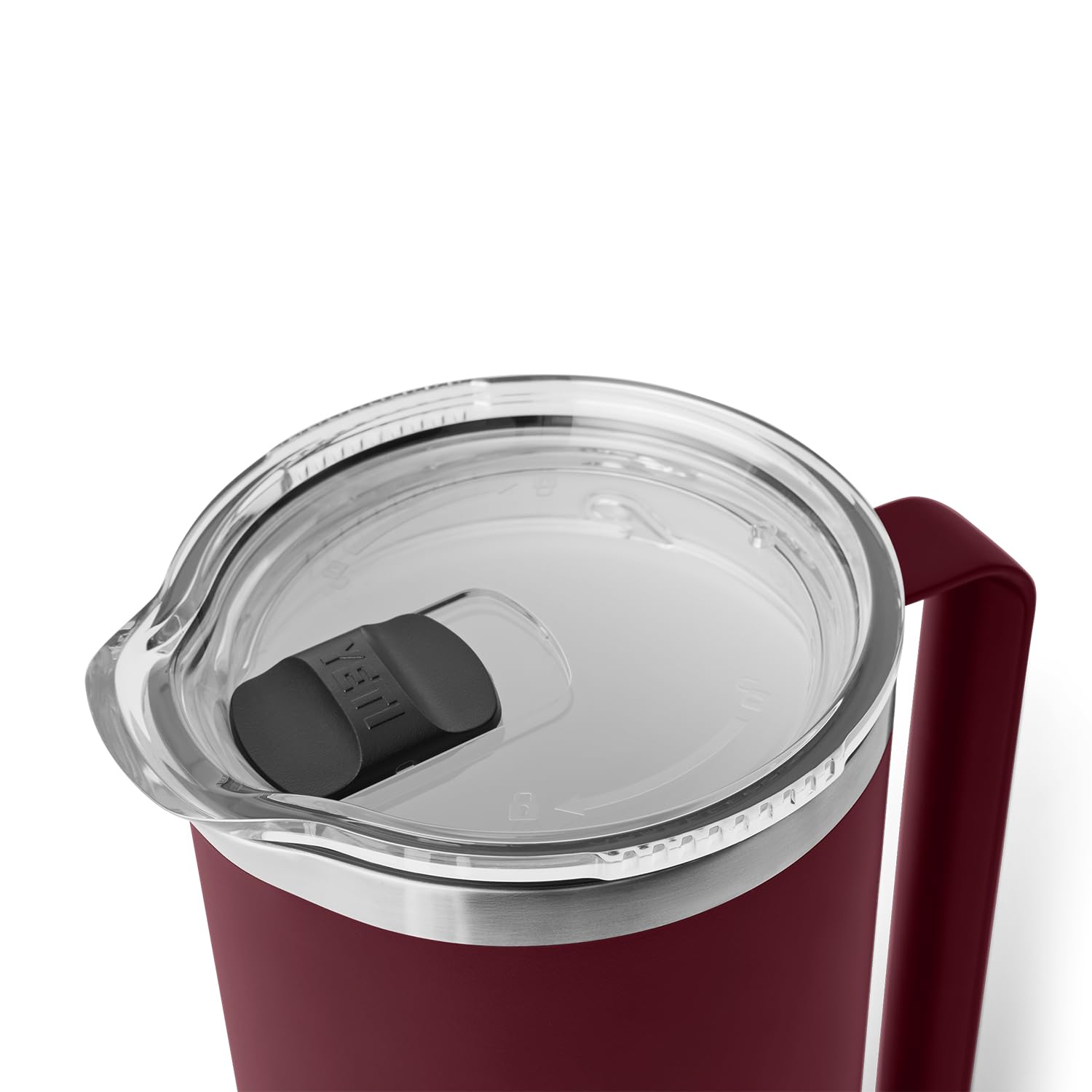 YETI Rambler being poured into a glass at a table setup.