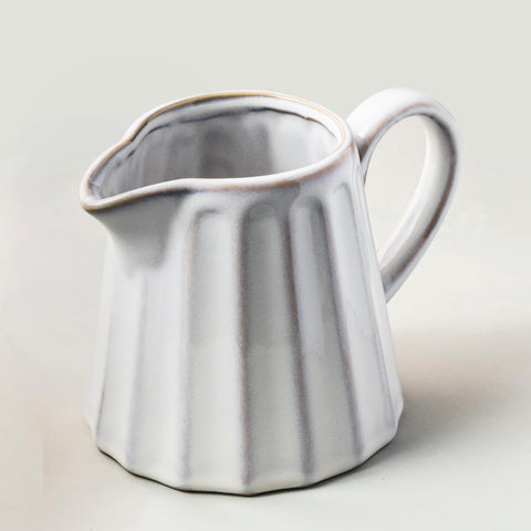 YHOJOY Ceramic Creamer Pitcher 17oz with handle, ideal for milk and cream at table.