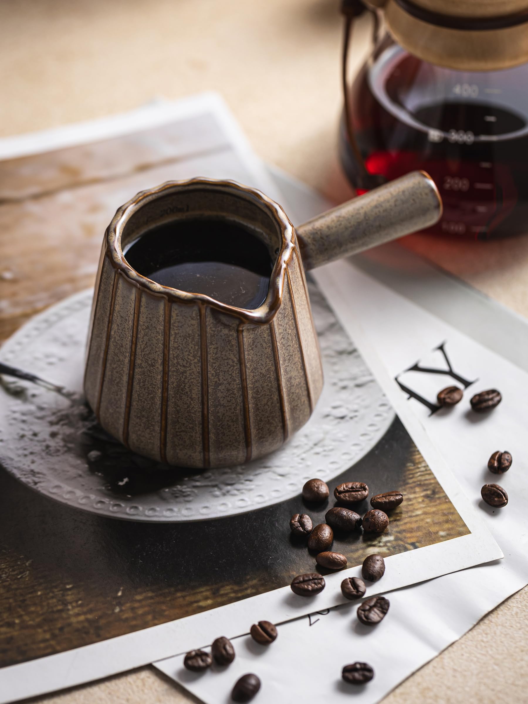 YHOJOY ceramic measuring cup 6oz for accurate pours.