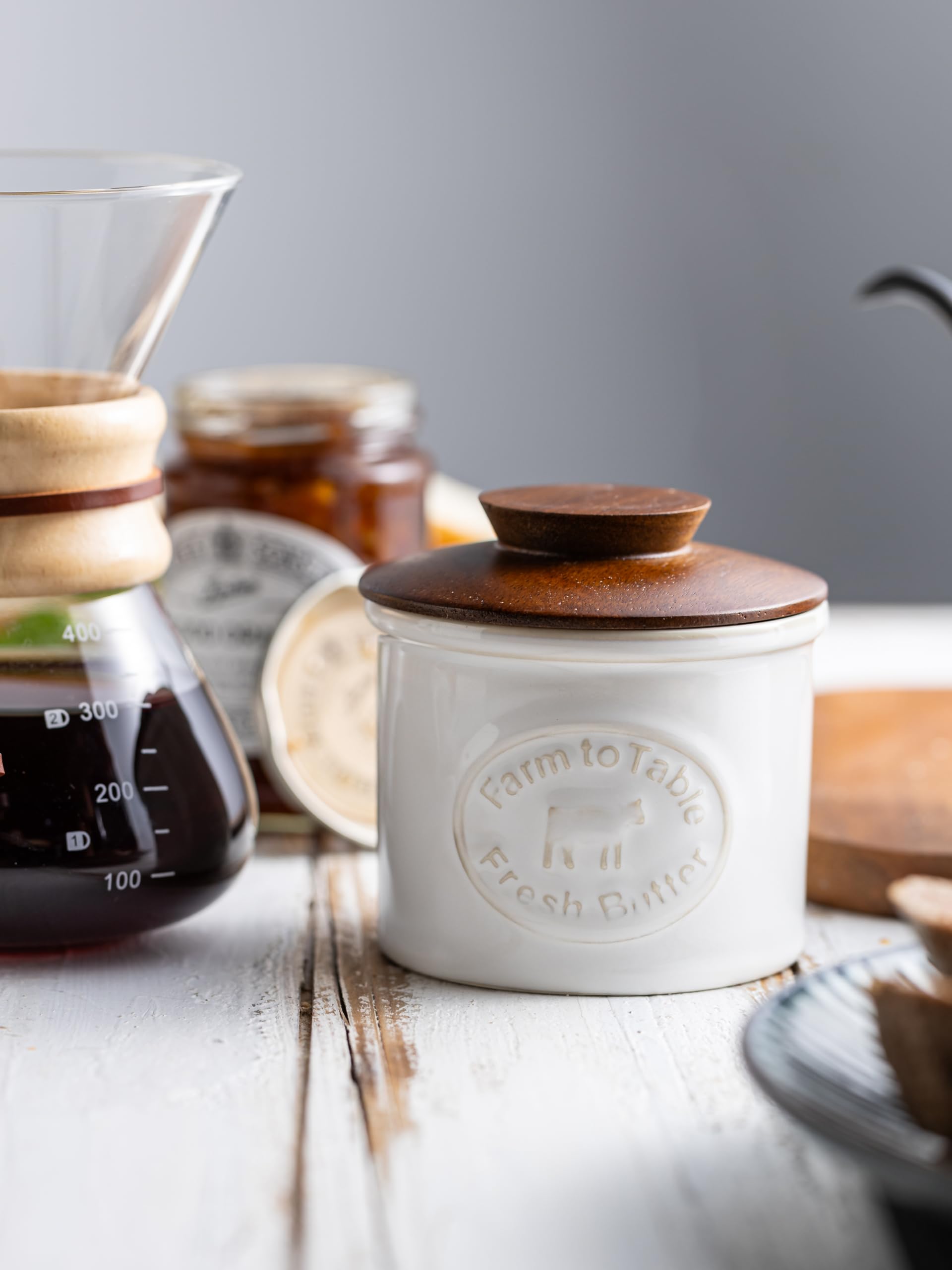 YHOJOY countertop butter dish on a kitchen island with compact footprint.