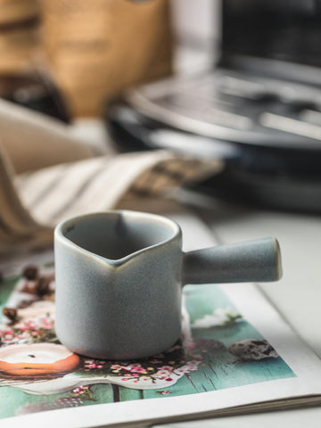 YHOJOY espresso cups with dual spouts for left or right handed users.