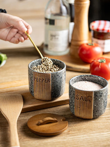 YHOJOY dual spoons set for precise dispensing of salt and pepper.