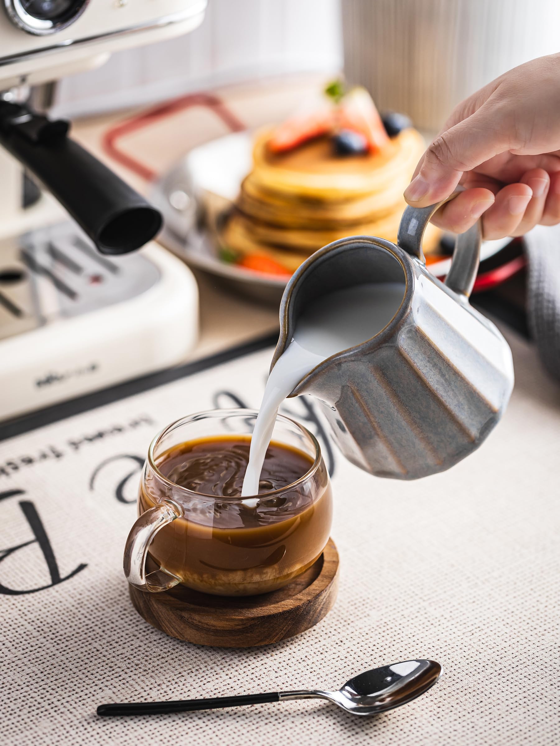 YHOJOY striped ceramic pitcher adds rustic charm to modern table settings.