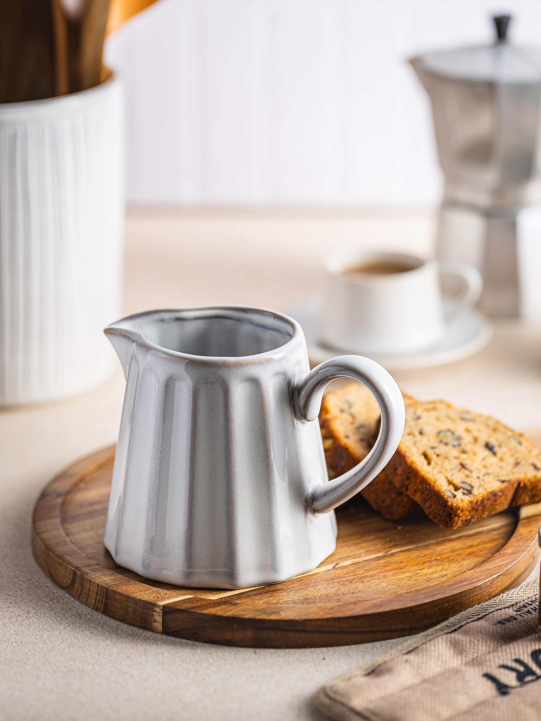 YHOJOY milk pitcher with vertical stripes adds cozy style to coffee service.