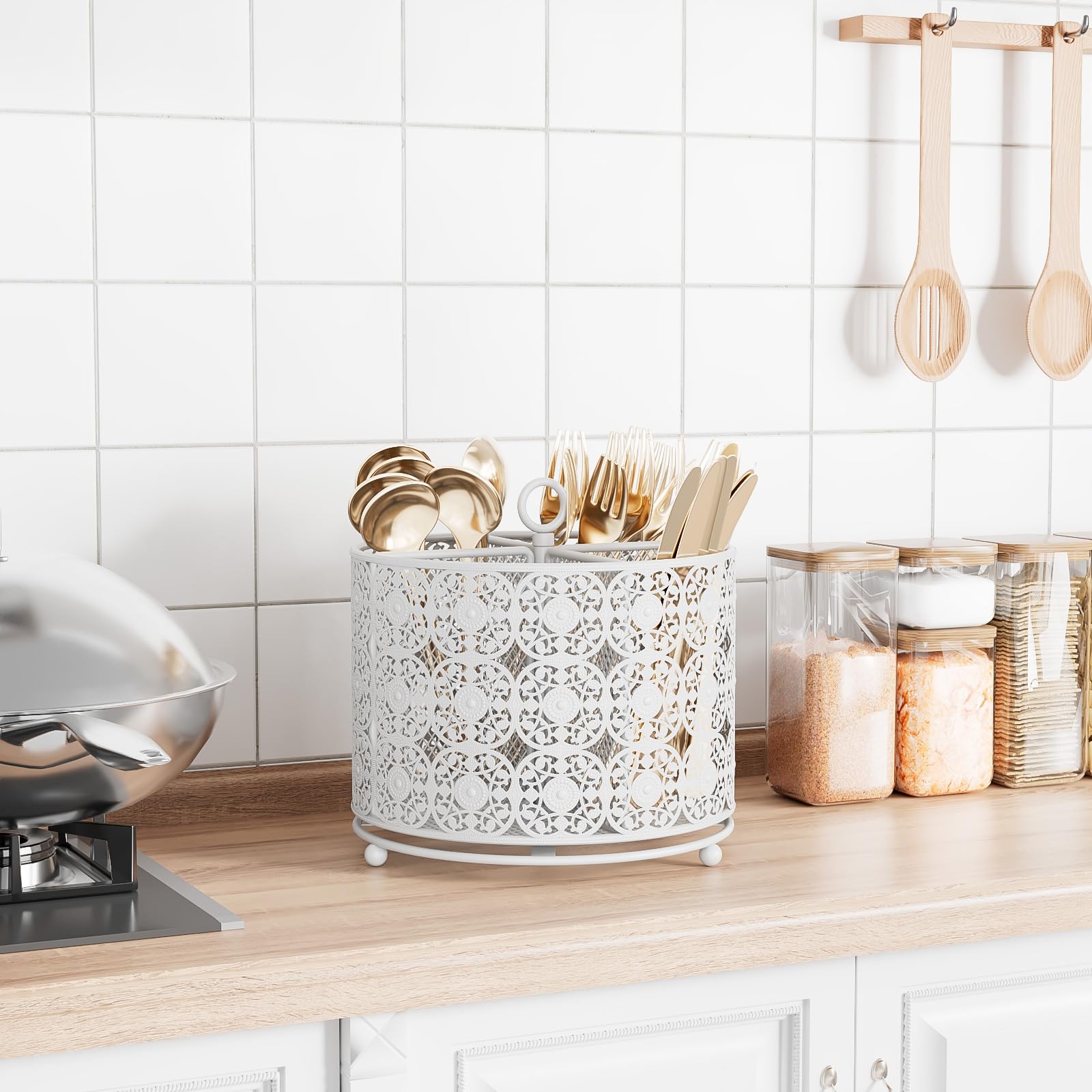 YIUKEA four-compartment metal caddy keeps kitchen utensils neatly organized on the counter.