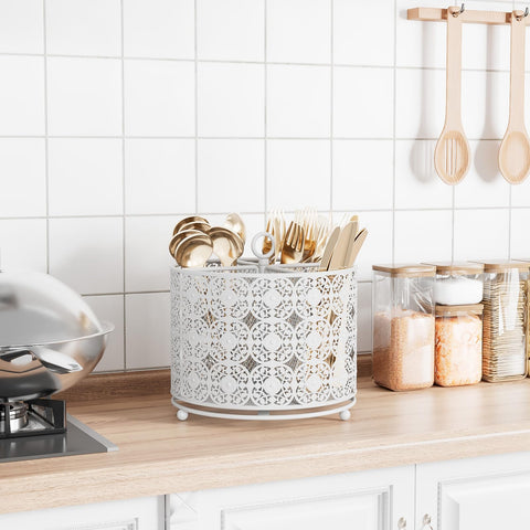 YIUKEA four-compartment metal caddy keeps kitchen utensils neatly organized on the counter.