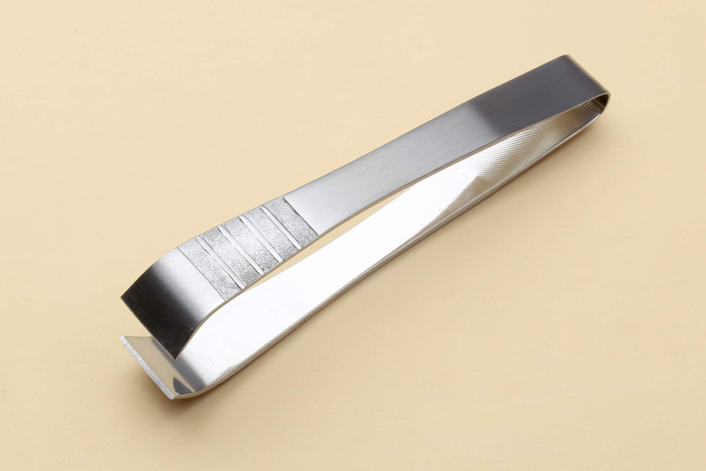 Yoshihiro non-slip tweezer helps pick tiny bones with controlled precision.