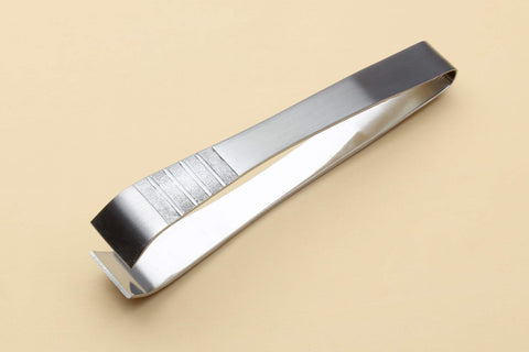 Yoshihiro non-slip tweezer helps pick tiny bones with controlled precision.