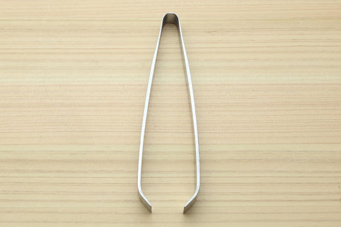 Yoshihiro garnishing-in-action shows clean, controlled movements for elegant plating.