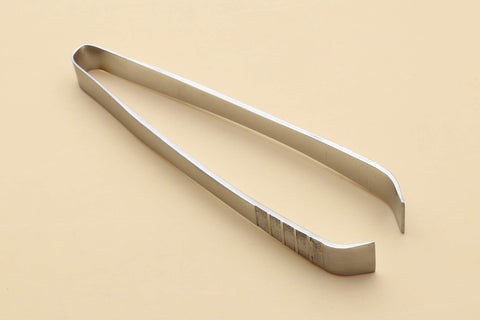Yoshihiro Japanese sushi garnishing tool with ergonomic grip for steady handling.