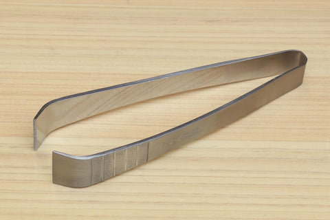 Yoshihiro made in Japan tool for precise garnish placement on nigiri.