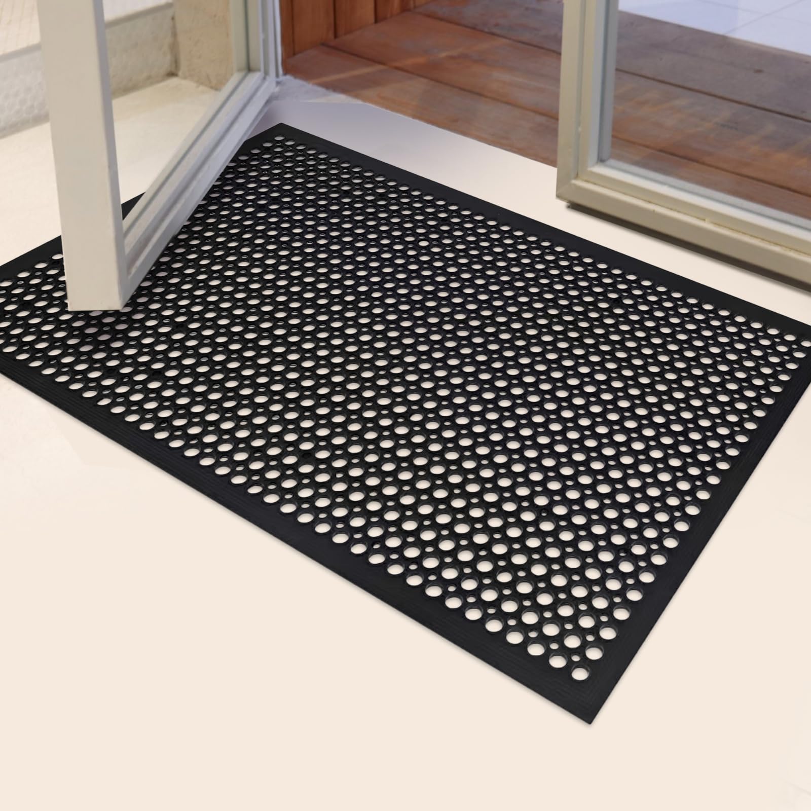 YOSHIKO drainage-hole mat traps dirt and drains liquids for cleaner floors.