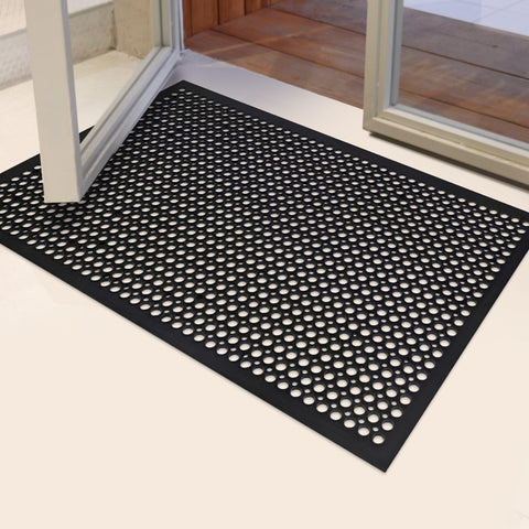 YOSHIKO drainage-hole mat traps dirt and drains liquids for cleaner floors.