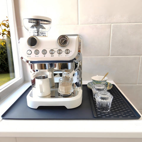 Yudevey silicone coffee mat with heat protection for countertops during hot brewing.
