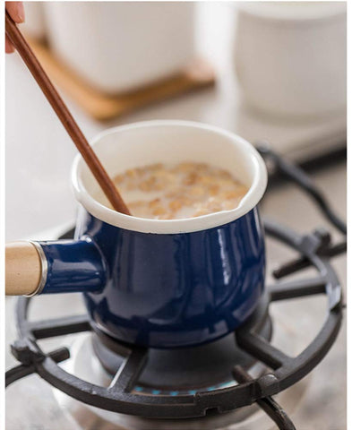 YumCute Home enamel milk pot wooden handle closeup shows comfortable grip