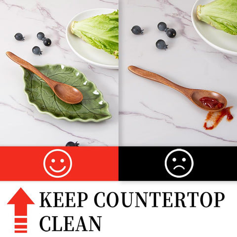 YumiPLUS ceramic leaf spoon rest close-up shows vibrant glaze texture and distinctive green finish.