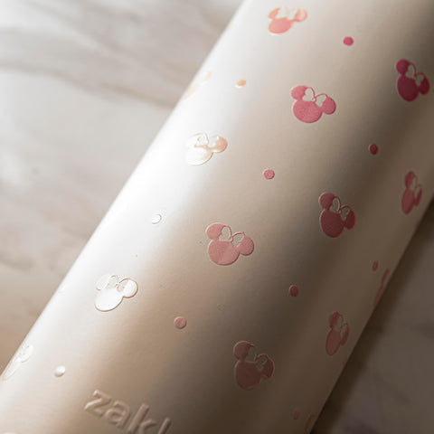 Minnie Mouse Harmony bottle carries with built-in handle for travel convenience.