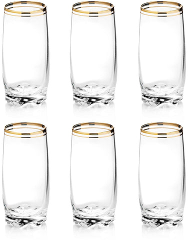 Zanzer gold rim glass cup on an elegant table, ideal for refined cocktails