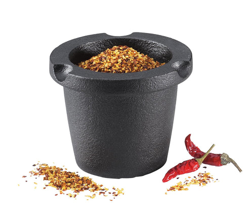 Zassenhaus manual grinder in action for grinding herbs and seeds.