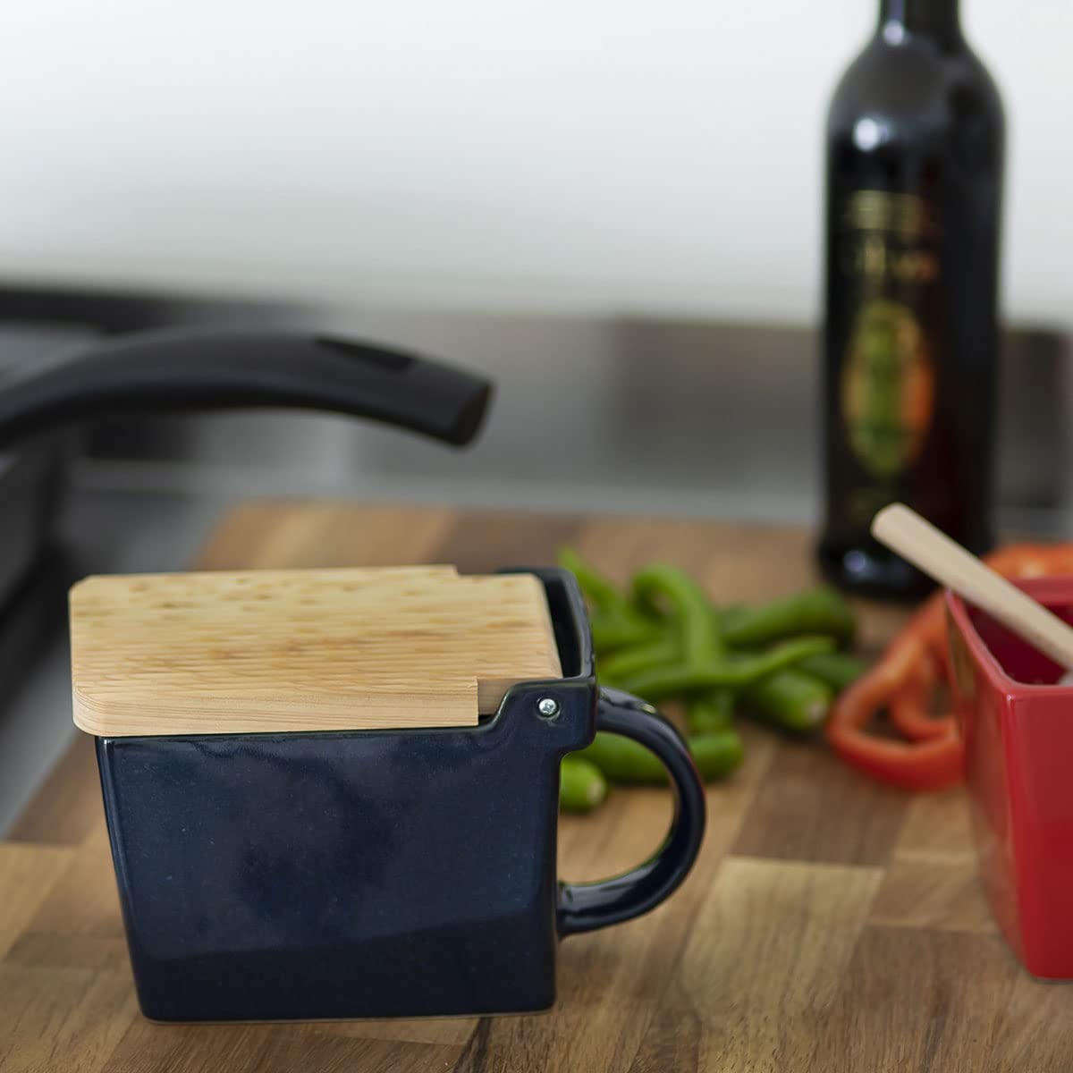Zero Japan Bee House salt box lid flips open one-handed for quick seasoning.